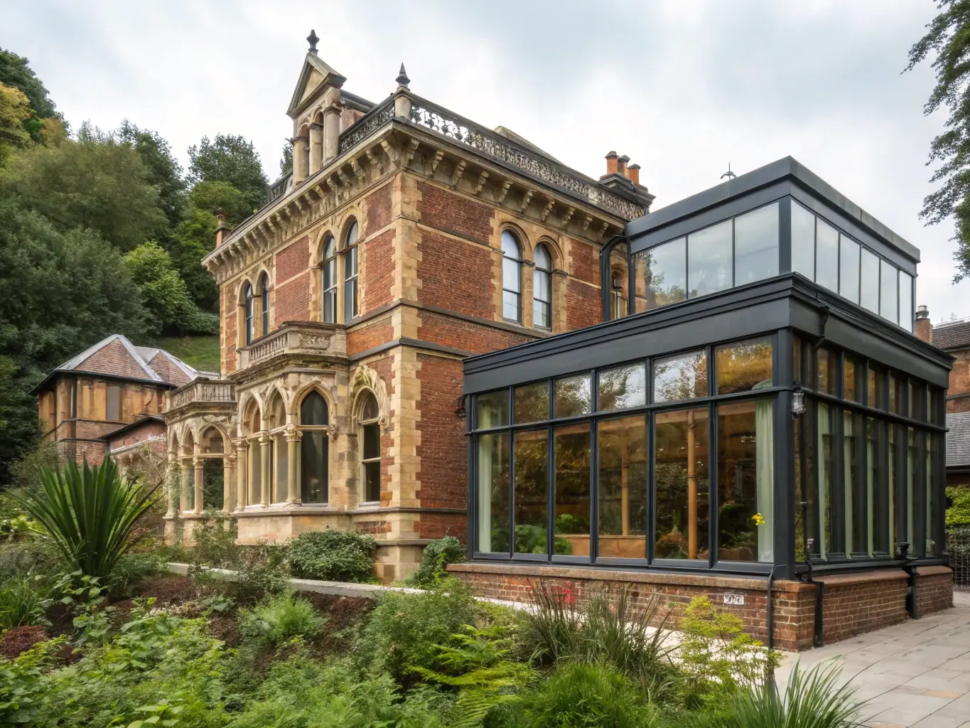 A beautifully restored stone building with a new roof and windows, surrounded by lush greenery, showcasing the heritage restoration efforts of LES AMIS DE CHATENET.