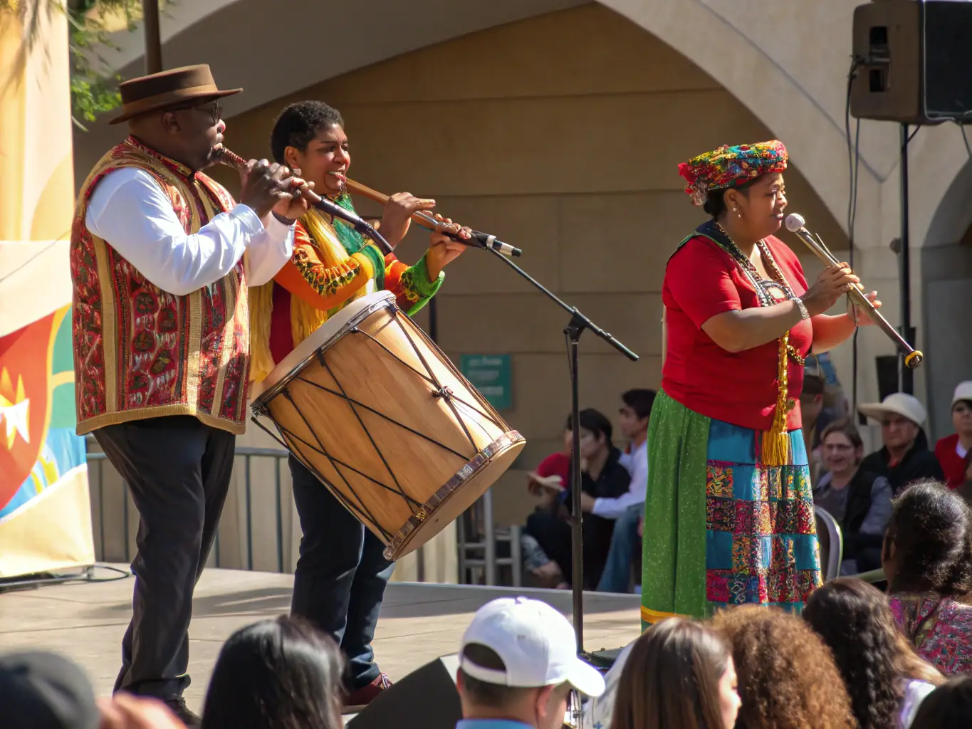 A vibrant scene from a cultural festival organized by LES AMIS DE CHATENET, featuring traditional music, dance, and local crafts, with people of all ages participating.